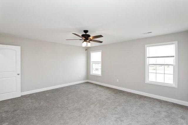 unfurnished room featuring carpet floors and ceiling fan