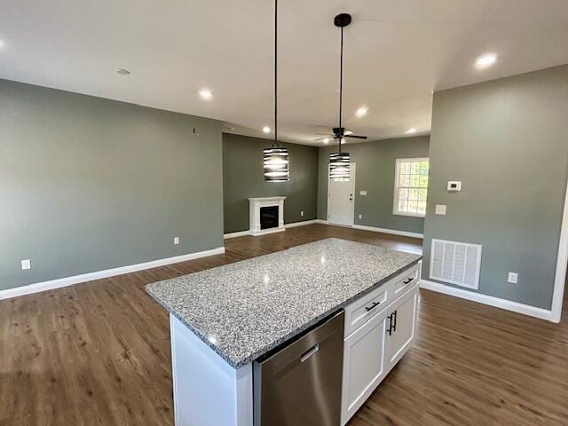 kitchen featuring dishwasher, white cabinets, ceiling fan, light stone countertops, and decorative light fixtures