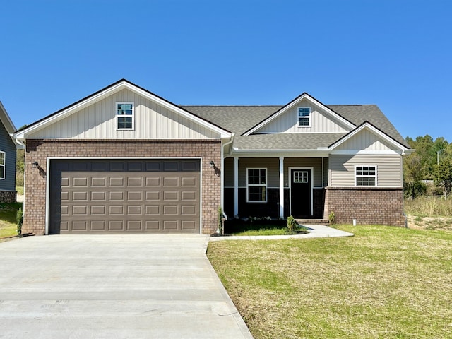 view of front of house featuring a garage and a front lawn