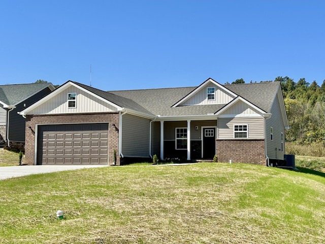 view of front facade featuring central AC unit, a garage, and a front yard