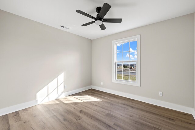 spare room with ceiling fan and light hardwood / wood-style floors