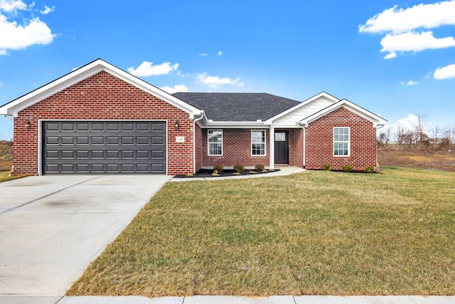 single story home featuring a garage, driveway, brick siding, and a front yard