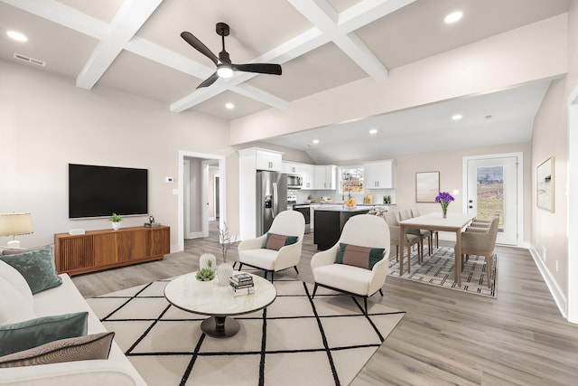 living room with coffered ceiling, ceiling fan, beamed ceiling, and light wood-type flooring