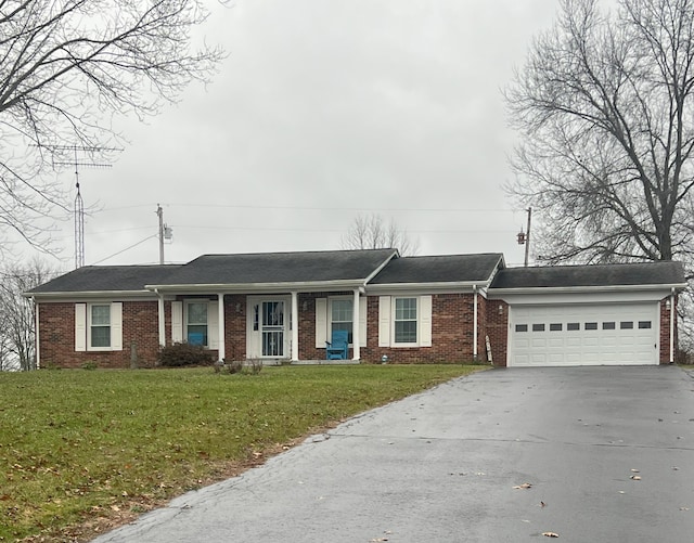 ranch-style house with a front yard and a garage