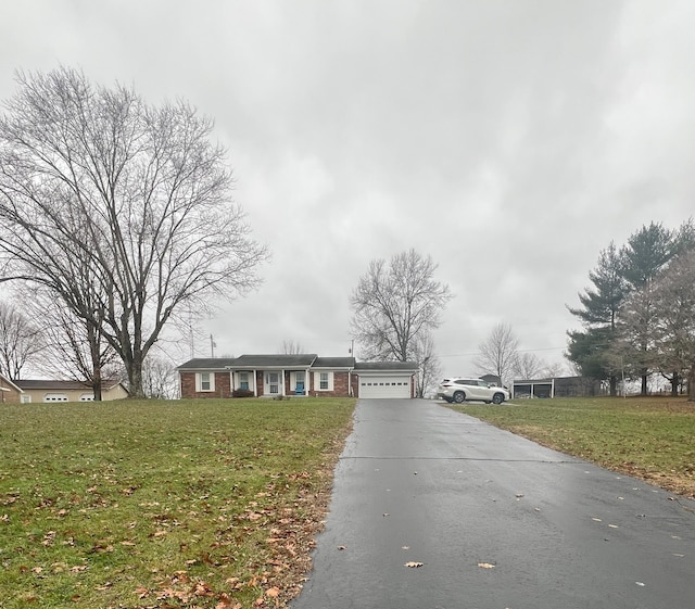 single story home with a front lawn and a garage