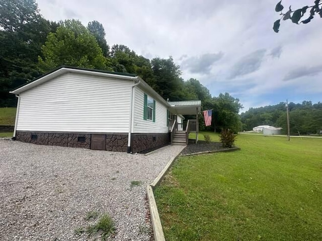 view of property exterior with a yard