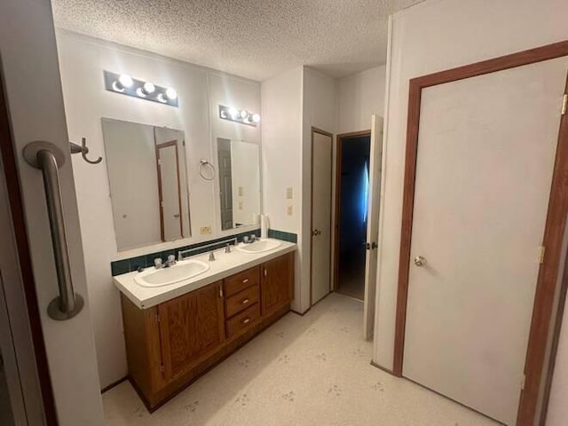 bathroom featuring vanity and a textured ceiling