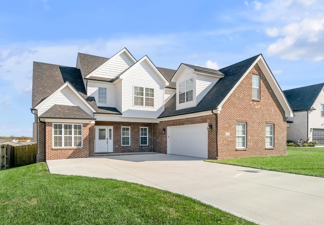 view of front of home with a garage and a front yard