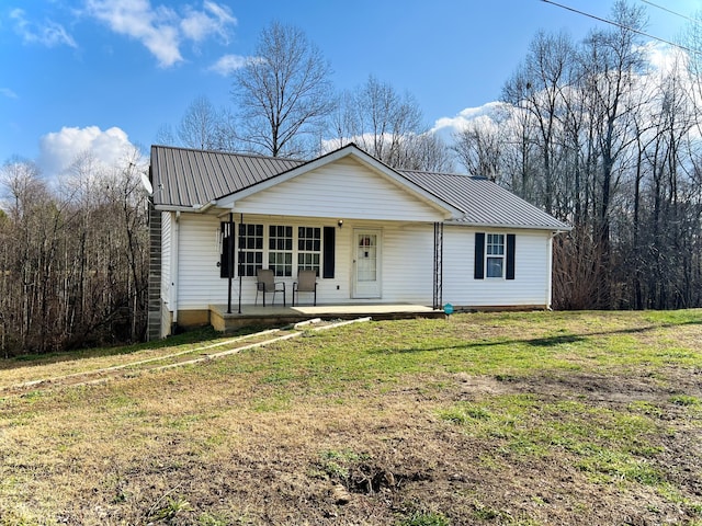 ranch-style home with covered porch and a front lawn