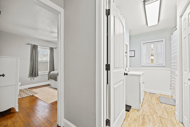 hallway with light wood-type flooring