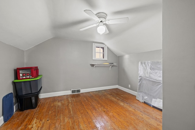 bonus room with ceiling fan, hardwood / wood-style floors, and vaulted ceiling