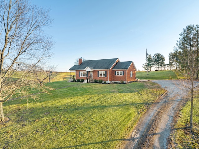 ranch-style house featuring a front lawn