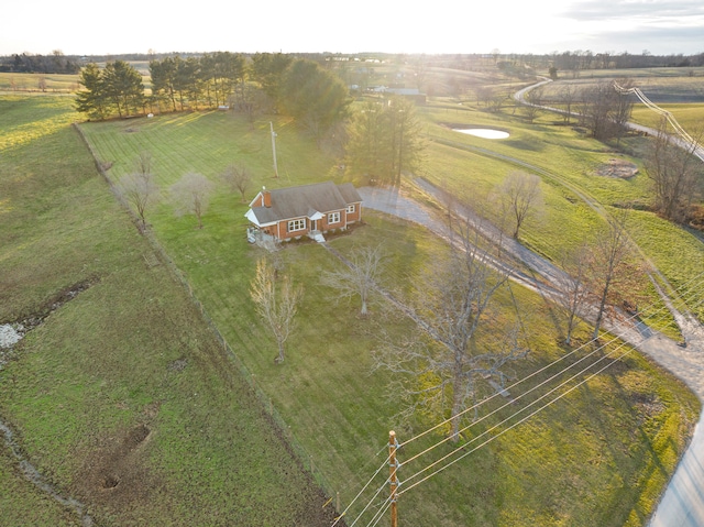 birds eye view of property with a rural view