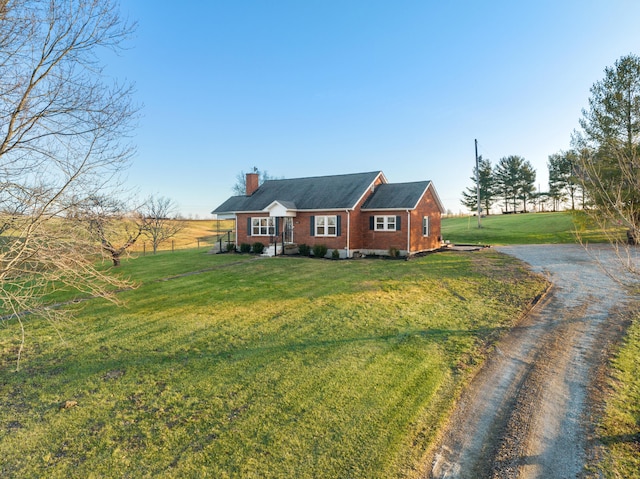 ranch-style home featuring a front yard