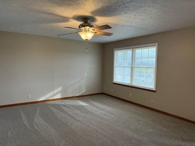 empty room with carpet and ceiling fan