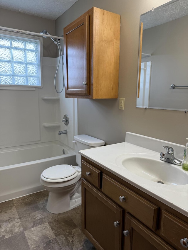 full bathroom with vanity,  shower combination, and toilet