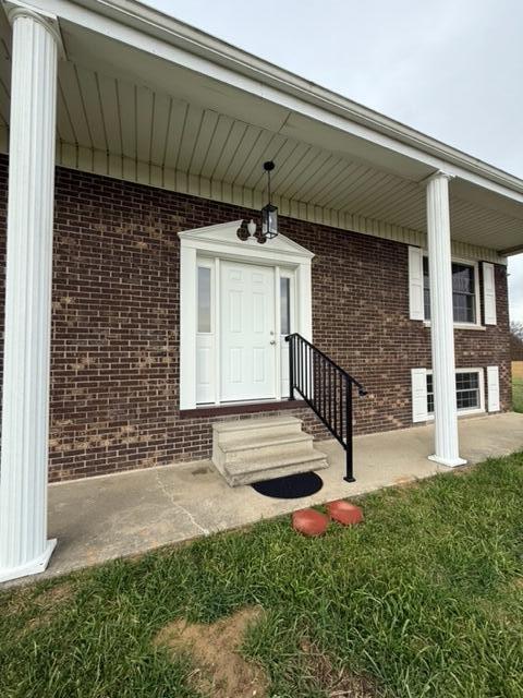 entrance to property with a yard