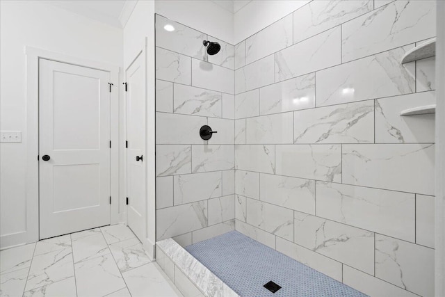 bathroom featuring tiled shower