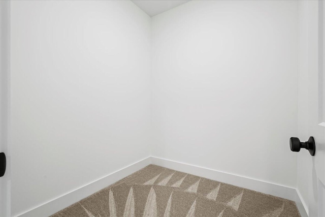 unfurnished room with carpet flooring