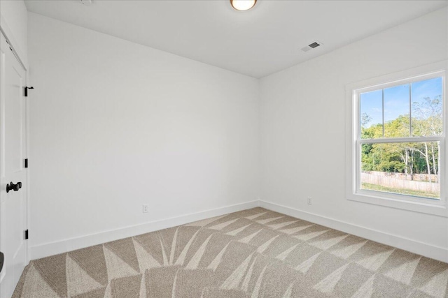 view of carpeted spare room