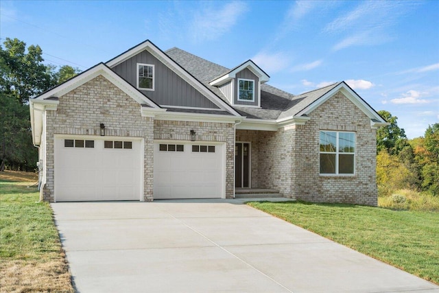 view of front of house featuring a garage and a front lawn