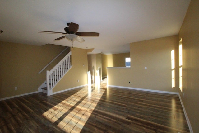 interior space with ceiling fan and dark wood-type flooring