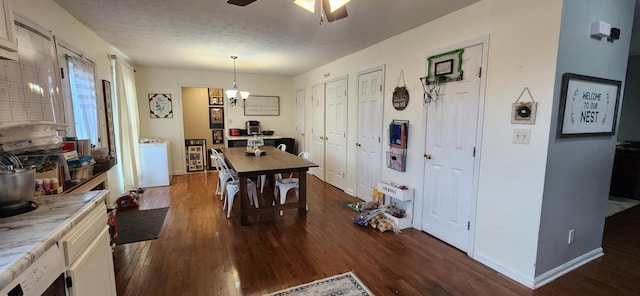 dining area with a textured ceiling, washer / clothes dryer, ceiling fan, and dark hardwood / wood-style floors