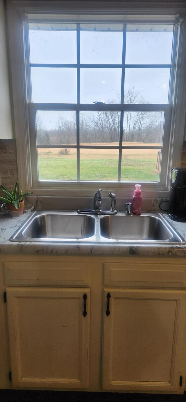 kitchen with sink and light brown cabinets