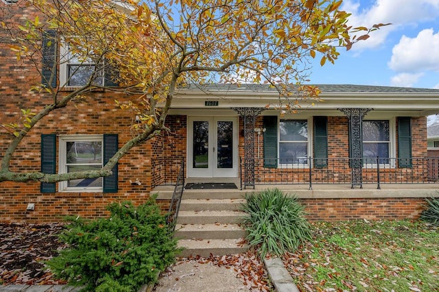 view of front facade with french doors and covered porch