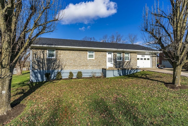 single story home featuring a front lawn and a garage