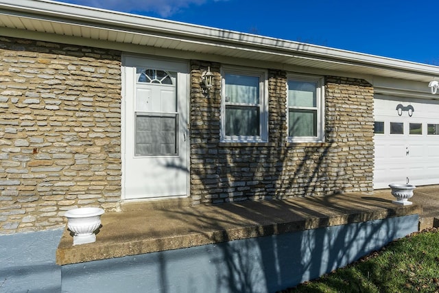 entrance to property featuring a garage