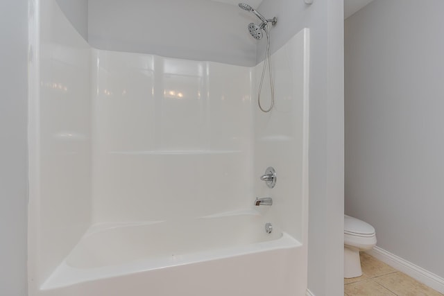 full bathroom with toilet and tile patterned floors
