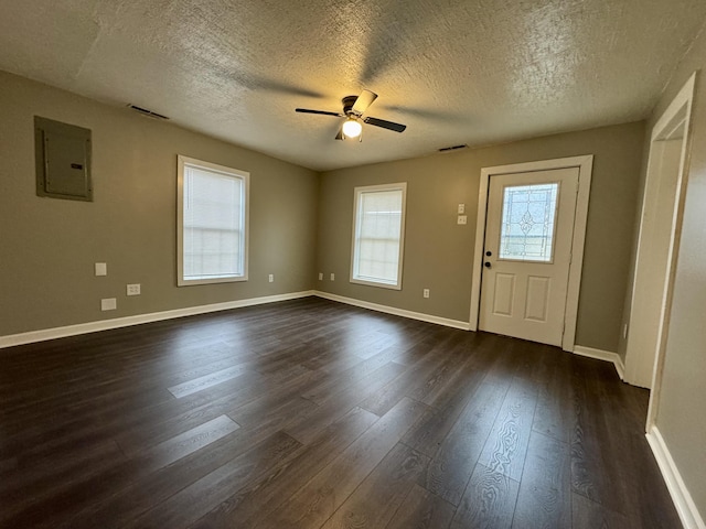 entrance foyer with a textured ceiling, electric panel, dark hardwood / wood-style floors, and ceiling fan