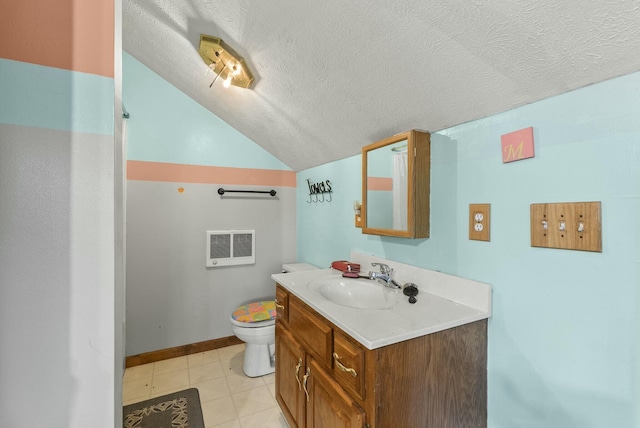 bathroom with tile patterned floors, a textured ceiling, vaulted ceiling, toilet, and vanity