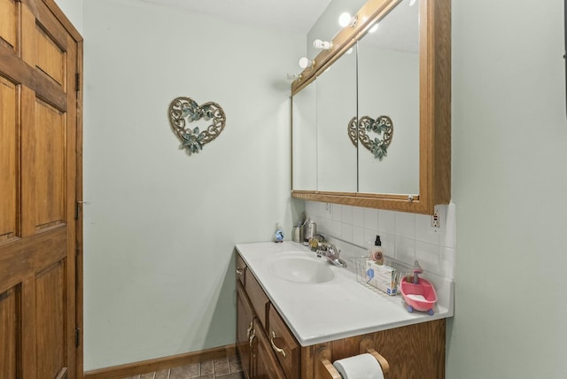 bathroom featuring decorative backsplash and vanity