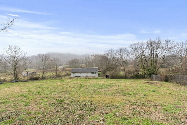 view of yard with a rural view