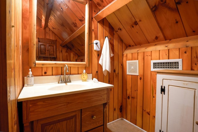 bathroom with wood walls, vanity, wooden ceiling, and lofted ceiling