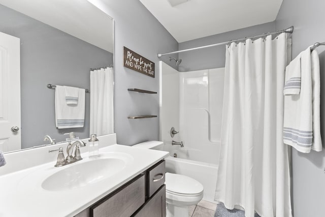 full bathroom featuring tile patterned floors, shower / tub combo with curtain, vanity, and toilet