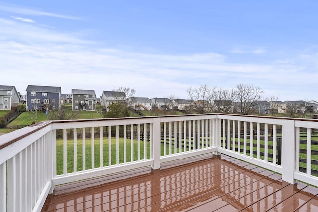 wooden deck with a lawn