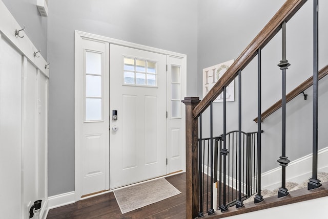 foyer with dark hardwood / wood-style floors