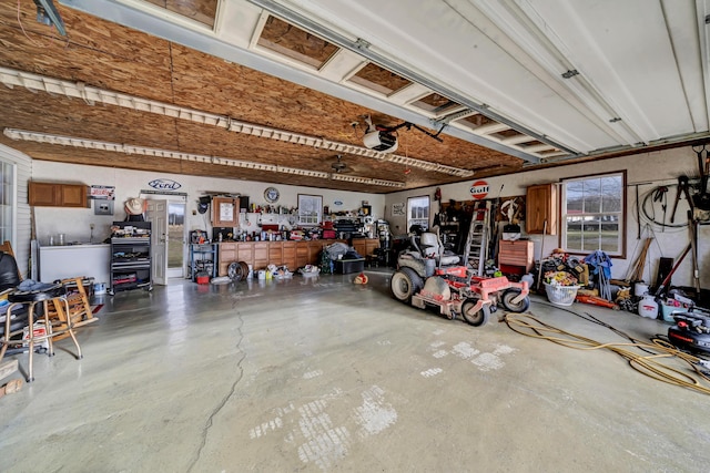 garage featuring a workshop area and a garage door opener