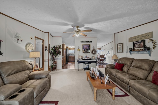 carpeted living room featuring ceiling fan, crown molding, and a textured ceiling