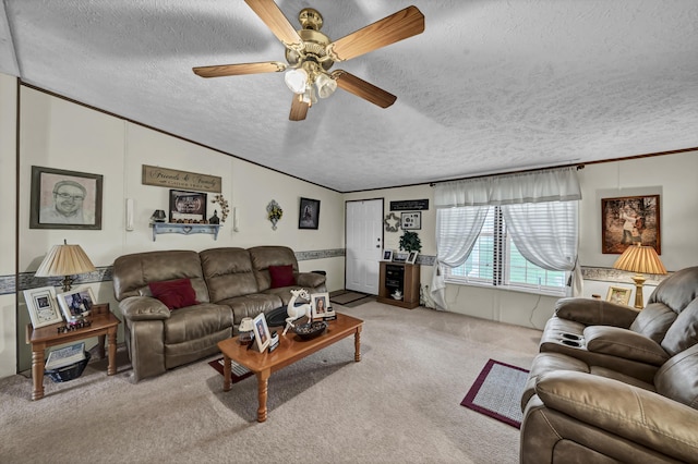 carpeted living room featuring ornamental molding, a textured ceiling, ceiling fan, and lofted ceiling