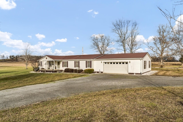 single story home with a garage and a front yard