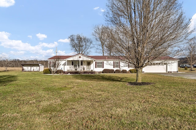 view of front facade with a storage unit, a porch, and a front yard