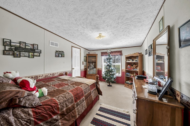 carpeted bedroom with a textured ceiling and ornamental molding