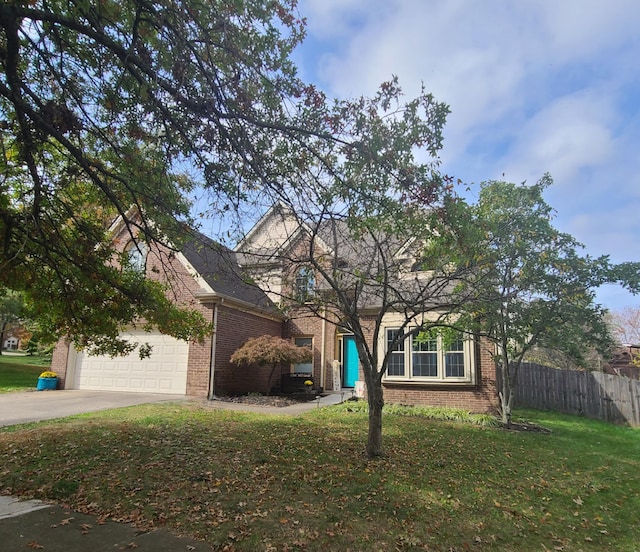 view of property hidden behind natural elements with a front yard