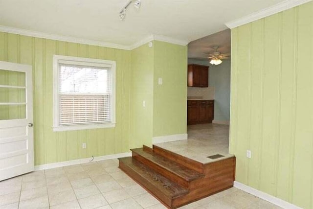 unfurnished room with crown molding, ceiling fan, and track lighting