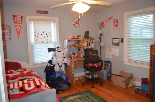 bedroom featuring ceiling fan and hardwood / wood-style flooring