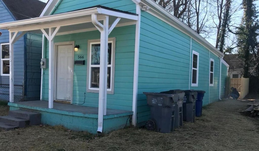 view of property exterior with covered porch